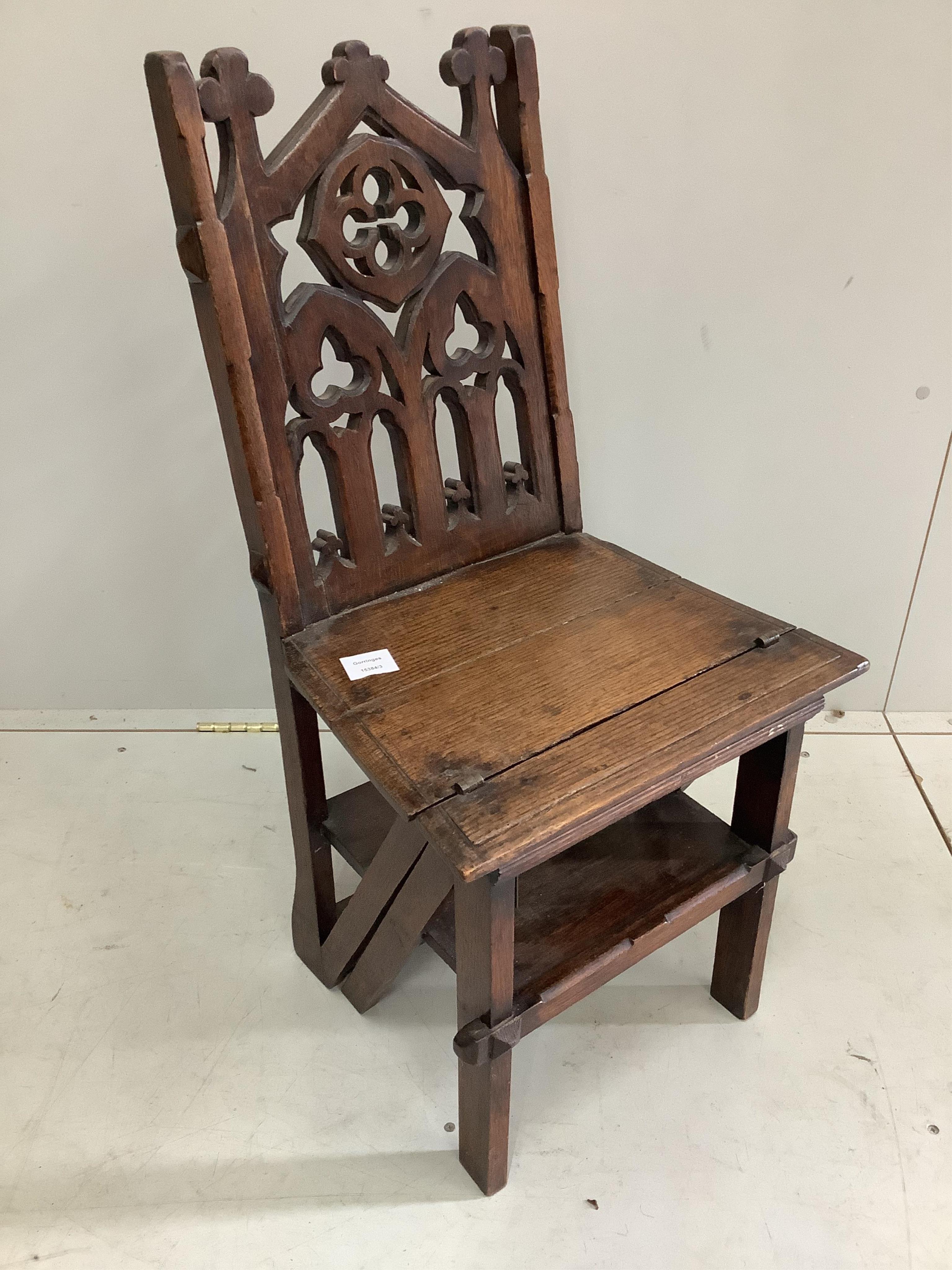 A Victorian Gothic Revival oak metamorphic library chair, width 40cm, depth 35cm, height 85cm. Condition - fair